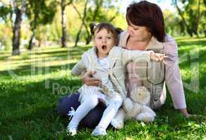 Grandmother with her little granddaghter in park