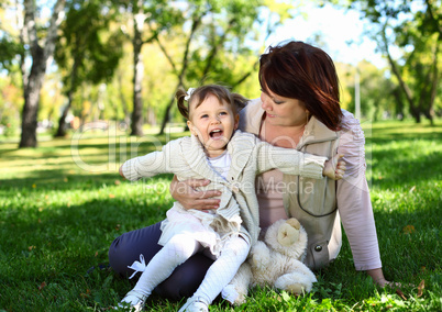 Grandmother with her little granddaghter in park