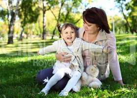 Grandmother with her little granddaghter in park