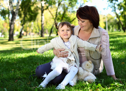 Grandmother with her little granddaghter in park