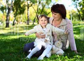 Grandmother with her little granddaghter in park