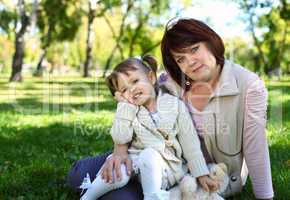 Grandmother with her little granddaghter in park