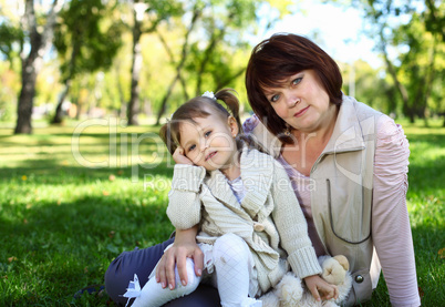 Grandmother with her little granddaghter in park