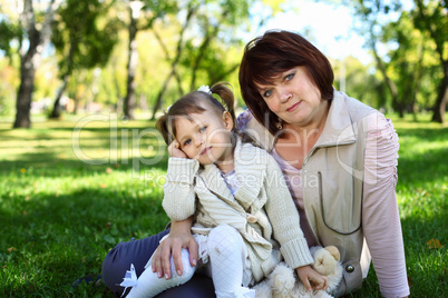 Grandmother with her little granddaghter in park Grandmother with her little granddaghter in park