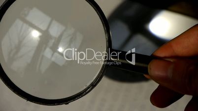 Focus of magnifying glass,In hand.