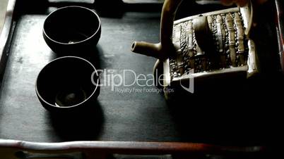 Teapot pouring tea,ancient customs of leisure.china,japan.