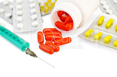 Capsule red with drugs and a syringe