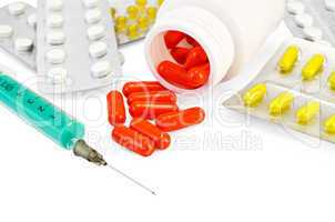 Capsule red with drugs and a syringe