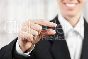 Businesswoman pinching finger sign
