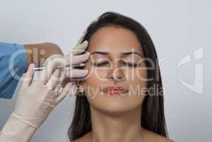 Cosmetic botox injection in the female face
