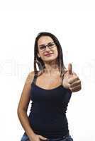 A young, successful woman holds his thumb up. Symbol for success