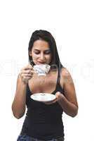 Lovely young woman with a cup of coffee in hands isolated on whi