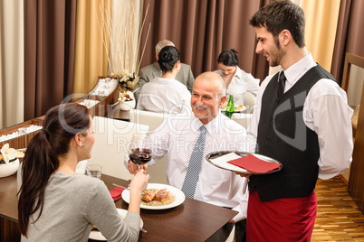 Business lunch executives toasting with red wine