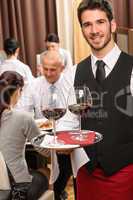Waiter hold wine glasses business lunch restaurant