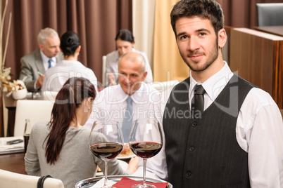 Waiter hold wine glasses business lunch restaurant