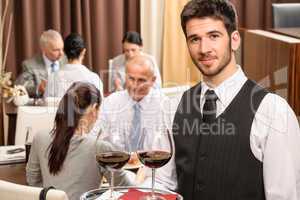 Waiter hold wine glasses business lunch restaurant