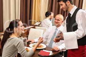 Business lunch waiter taking order at restaurant