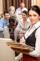 Waitress hold menu business people at restaurant