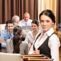 Waitress hold menu business people at restaurant