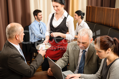Businessman pay restaurant bill management meeting