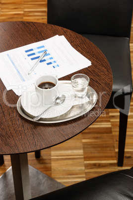 Coffee break business table with reports charts