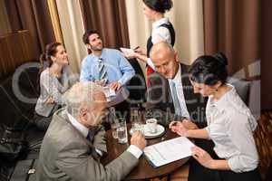 Business meeting executives dealing at restaurant
