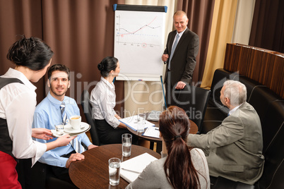 Business man at team meeting discuss flip-chart