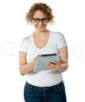 Glamorous lady using her tablet pc