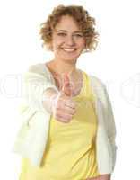 Glamorous woman gesturing thumbs-up