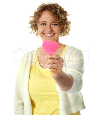 Happy woman offering her heart