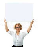 Happy woman holding blank billboard