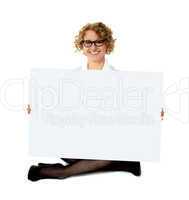 Female employee holding white blank banner ad