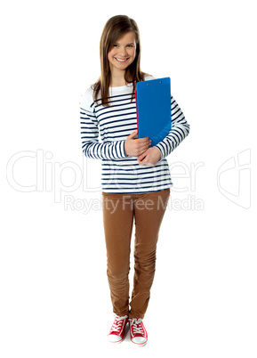 Attractive young girl smiling in front of camera