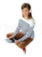 Pretty girl enjoying music on headphones