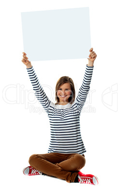 Girl holding blank billboard in upward direction
