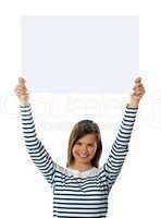 Cute girl lifting blank placard high