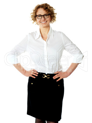 Female executive posing with hands on her waist