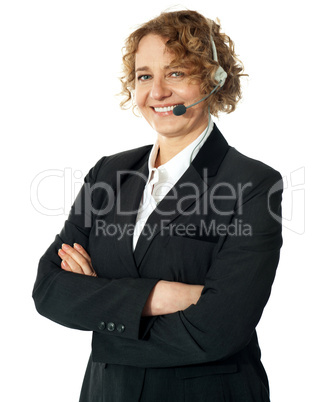 Smiling female operator with crossed arms