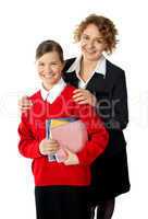 Teacher with her student, posing