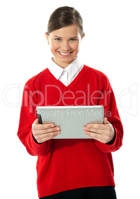 School girl holding tablet computer