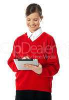 School girl using new touch pad device