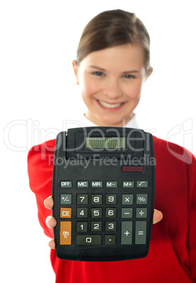 Smiling school girl showing digital calculator