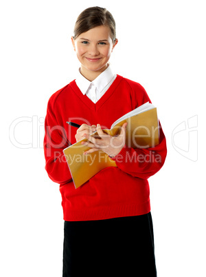 Caucasian student school girl writing on her notebook
