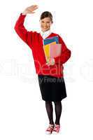 Full length view of student girl with giving hi5