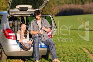 Camping couple inside car summer sunset countryside