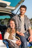 Camping young couple smiling together