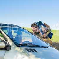 Hitch-hiking getting lift young woman in car