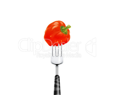 Red pepper pierced by fork,  isolated on white background