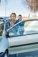 Pushing car technical failure two young women