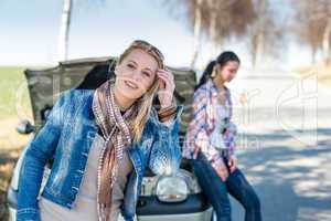 Car defect two women wait for help